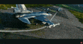 a fighter jet with the number 33-67 on the tail sits on a runway