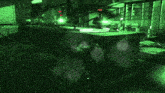 a person is standing in a dark room with green lights on the walls .