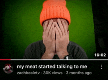 a video of a man covering his face with his hands with the time of 16:02