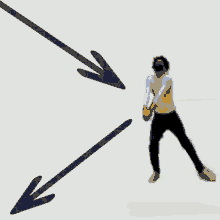a man wearing a mask is holding a volleyball