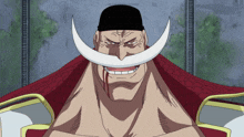 a man with a white beard and a black hat is smiling