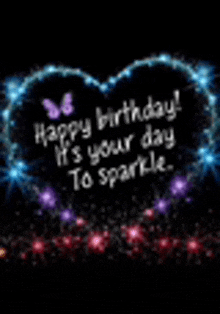 a happy birthday card with a heart made of lights and sparkles