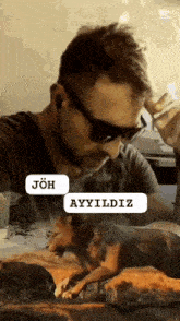 a man wearing sunglasses and ear buds talks on a cell phone