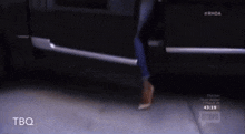 a man is getting out of a car with bravo written on the bottom right