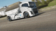 a white truck has the number 26 on the side