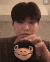 park jeongwoo treasure jeongwoo playing stuffed toy nodding head stuffed toy nodding