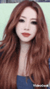 a close up of a woman 's face with videocook written below it