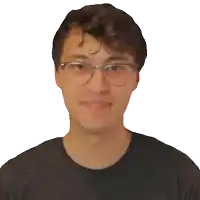 a young man wearing glasses and a black shirt is smiling