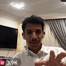 a man in a white shirt has 3.9k followers on his facebook page