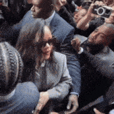 a man taking a picture of a woman with a camera that says " o " on it