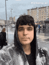 a man wearing a fur coat is taking a selfie with pixverse.ai