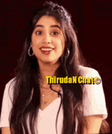 a woman with long hair wearing a white shirt and hoop earrings is smiling and making a funny face .