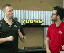 a man in a play tech shirt says you 're to another man