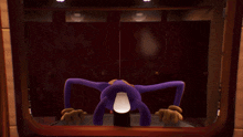 a purple cartoon character is standing in a dark room