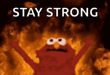elmo is surrounded by flames and the words stay strong are above him