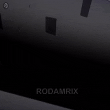 the word rodamrix is on a black surface