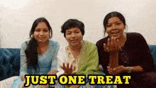 three women sit on a couch with the words just one treat