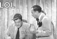 two men are standing next to each other and one of them is asking who 's on first