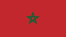 a red background with a green star in the center
