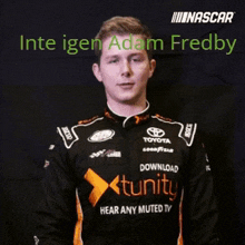 a man in a nascar shirt is making a gesture