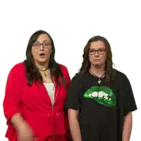 two women standing next to each other with one wearing a black shirt with a green lip