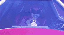 a person in a pink hoodie is holding a gun in a dark room .