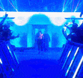a wrestler is walking through a tunnel of blue light