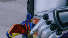 a close up of a toy that looks like a glove with buttons on it