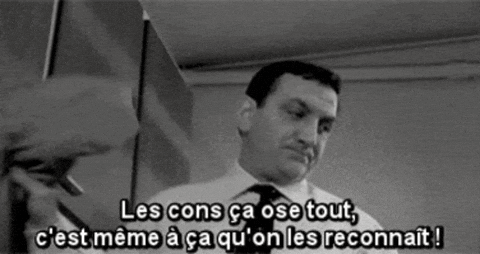 a man in a white shirt and tie says les cons ca ose tout c'est meme a ca qu'on les reconnait