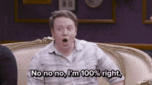 a man sitting on a couch with his mouth open and says no no no i 'm 100 % right