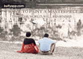 a man and a woman are sitting in front of a painting that says i want to paint a masterpiece