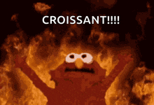 sesame street elmo is on fire with the words croissant written above him