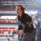 a man is holding a gun and screaming in a stadium while wearing sunglasses .