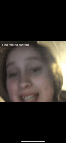 a close up of a person 's face with a blurred background .