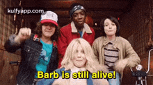 a group of young people are standing next to each other and one of them is saying `` barb is still alive ! ''