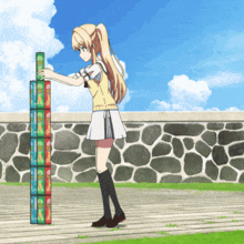 a girl is stacking boxes of potato chips