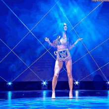 a woman is dancing on a stage with the hashtag #thenextbig thing