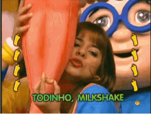 todinho milkshake is being advertised by a woman