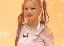 a woman with pigtails is wearing a white shirt and a necklace .