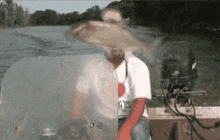 man repeatedly slaped by a fish