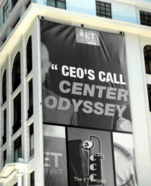 a large billboard on the side of a building that says ceo 's call center odyssey