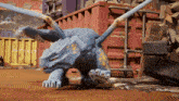 a toy dinosaur with wings is standing in front of a container that says ' cargo ' on it