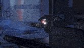 a red flame is coming out of a machine in a room