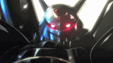 a close up of a robot with red lights on its eyes