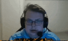 a man wearing glasses and headphones with a microphone