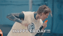 a man is holding a carrot and saying happy friday