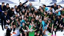 a group of soccer players are posing for a photo and one of them is wearing number 9