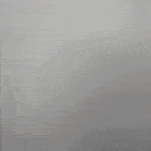 a blurry picture of a woman 's face with a white shirt on .
