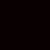 a close up of a fire with sparks flying in the dark