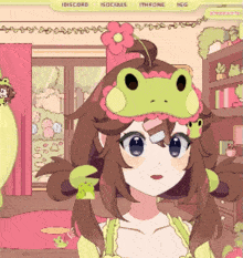 a girl wearing a frog hat with a flower on her head